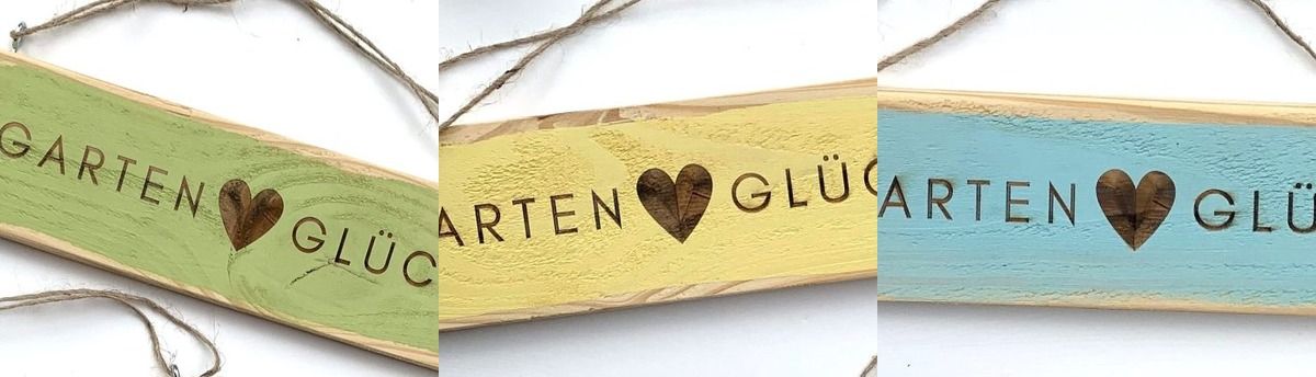 Drei Gartenschilder aus Palettenholz in Grün, Gelb und Türkis nebeneinander